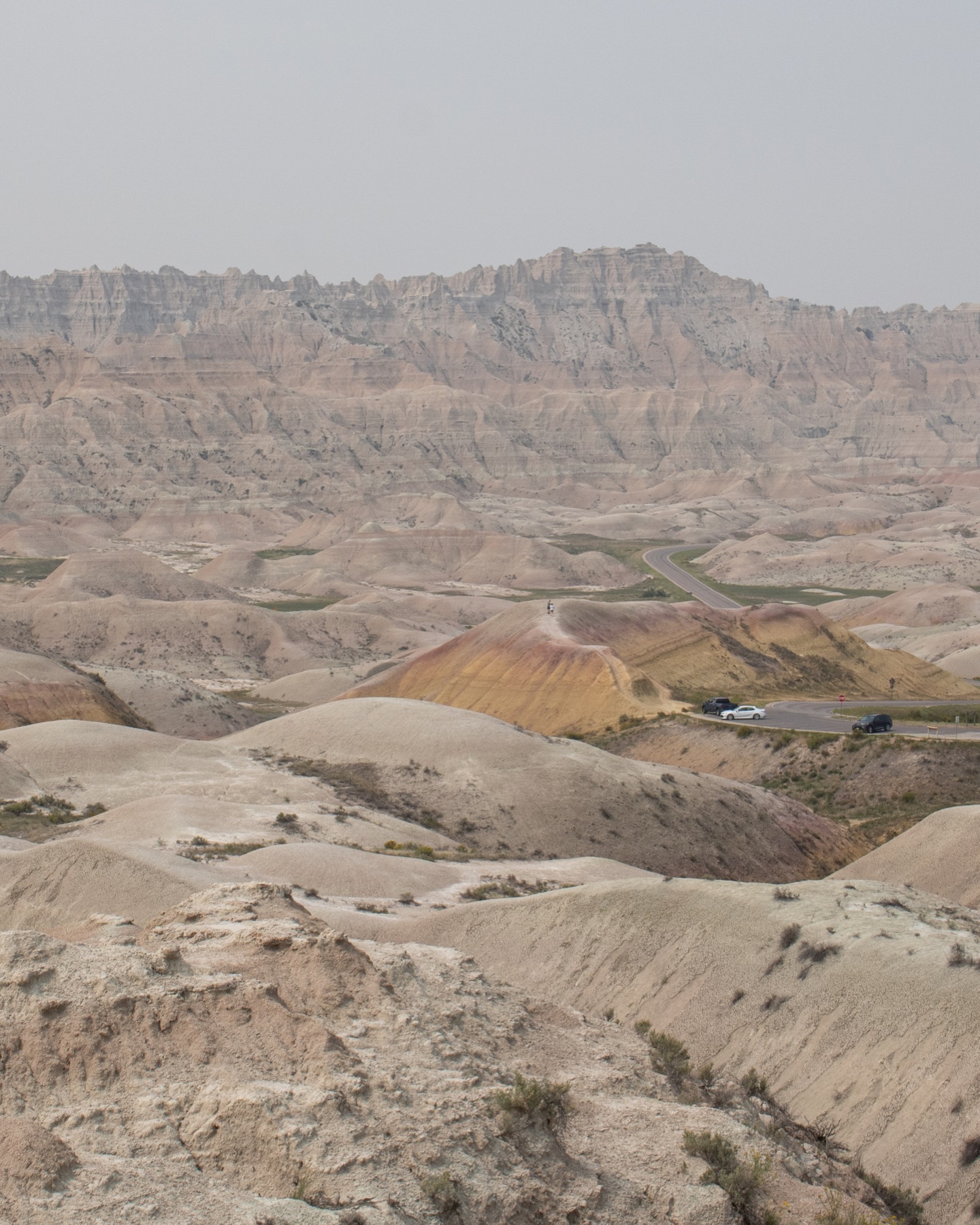 Yellow mounds and distant ridges in Badlands National Park