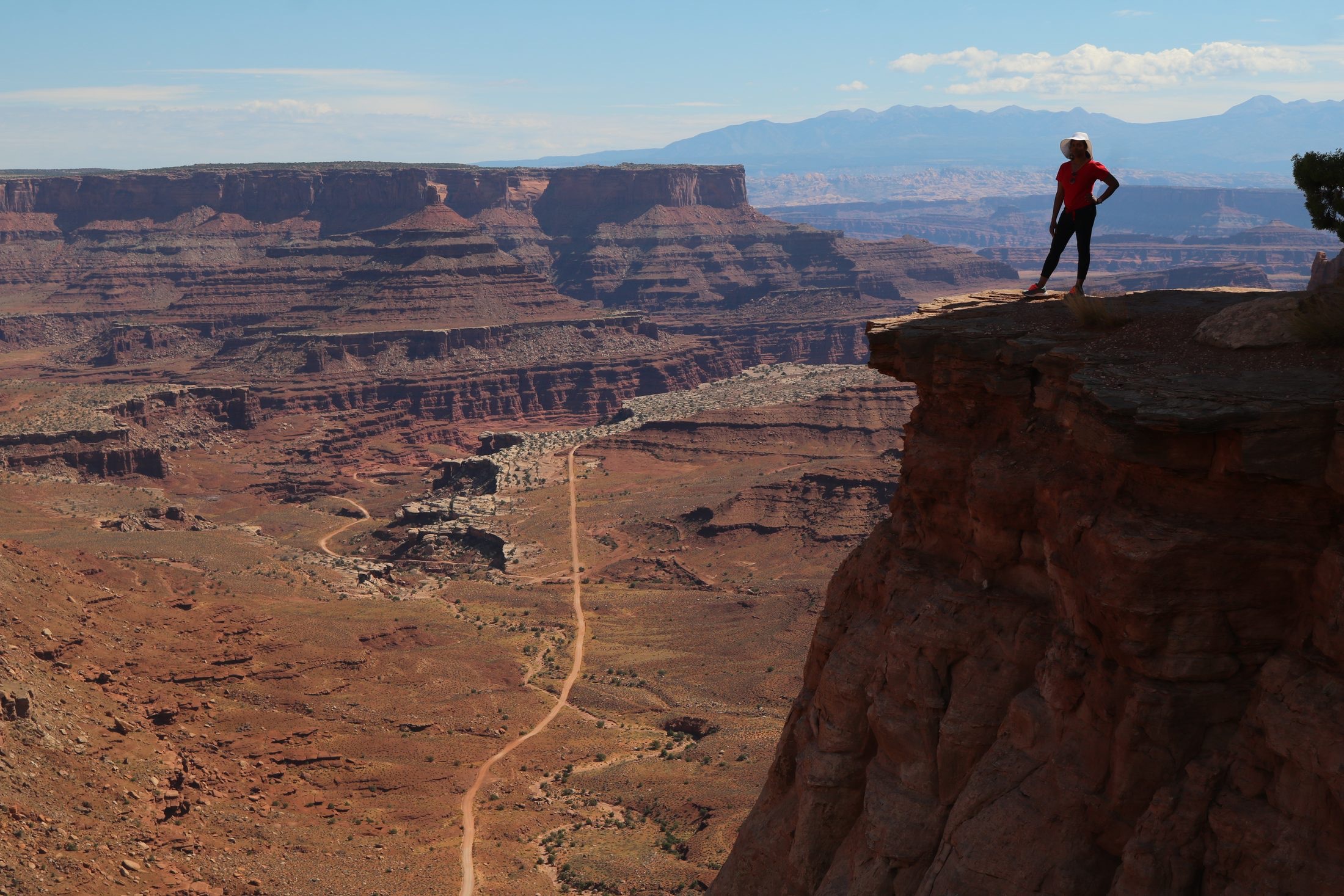 Traveler overlooking vast Utah canyon country